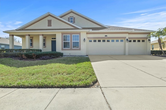 view of front facade with a garage and a front lawn