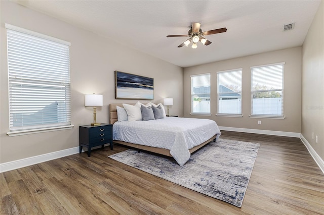 bedroom featuring hardwood / wood-style floors and ceiling fan