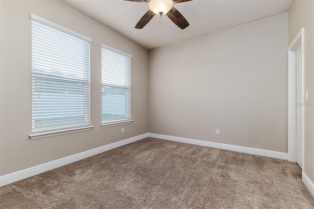 empty room featuring ceiling fan and carpet flooring