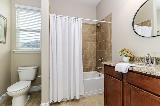 full bathroom featuring vanity, shower / bath combo, and toilet