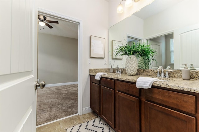 bathroom featuring ceiling fan, vanity, and tile patterned flooring