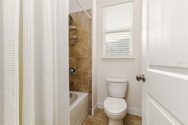 bathroom featuring tile patterned floors, toilet, and shower / bath combo with shower curtain