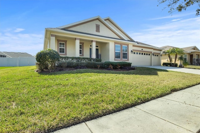 view of front of property with a garage and a front lawn