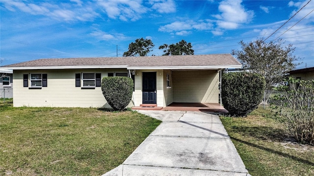 ranch-style home with a front yard