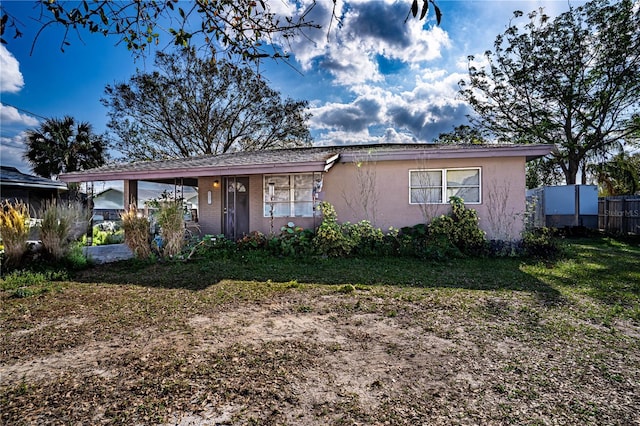 view of front of house with a front yard and covered porch