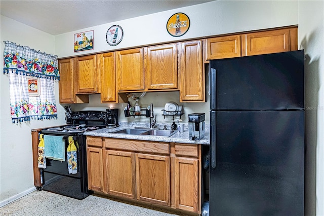 kitchen with sink and black appliances