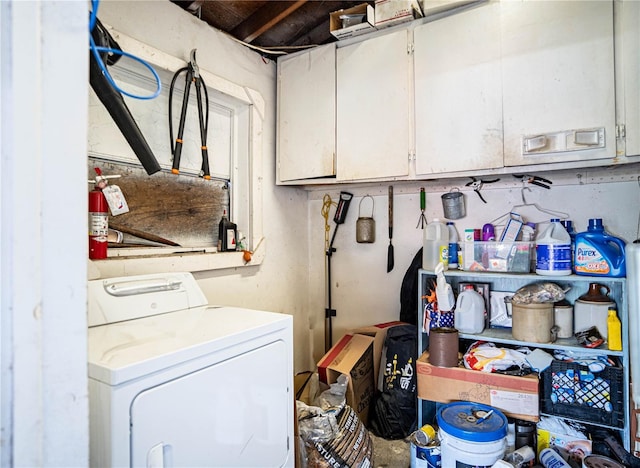 laundry area with washer / clothes dryer and cabinets