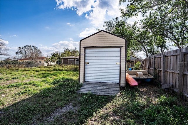 view of outbuilding featuring a lawn