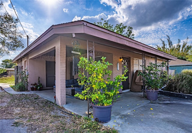 exterior space with an outdoor living space and a patio