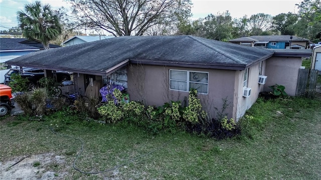 view of home's exterior with a yard and cooling unit