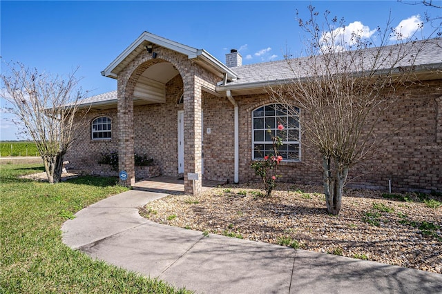 entrance to property with a yard