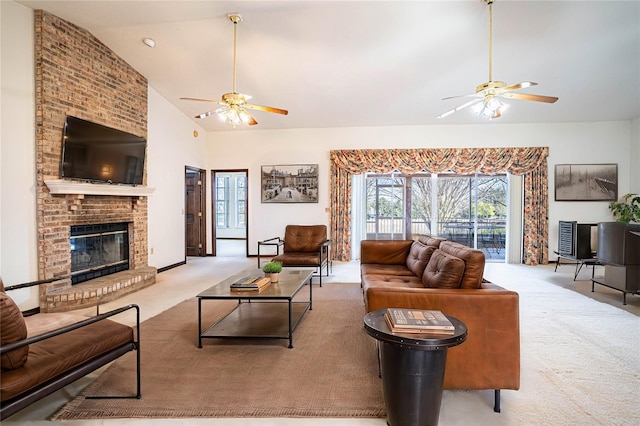 living room with high vaulted ceiling, a brick fireplace, light colored carpet, and ceiling fan