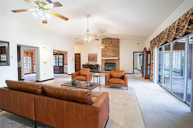 living room featuring ceiling fan, light colored carpet, vaulted ceiling, and a brick fireplace