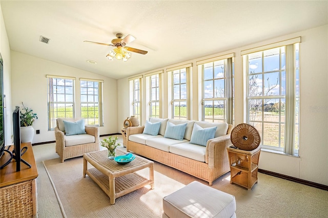 sunroom featuring vaulted ceiling and ceiling fan