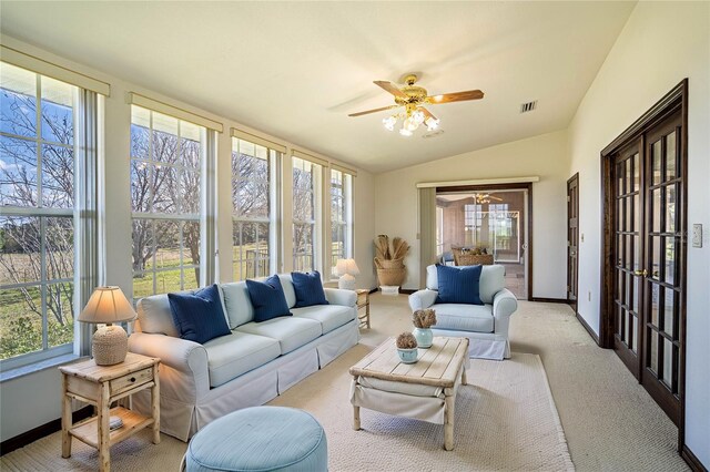 sunroom featuring ceiling fan and vaulted ceiling