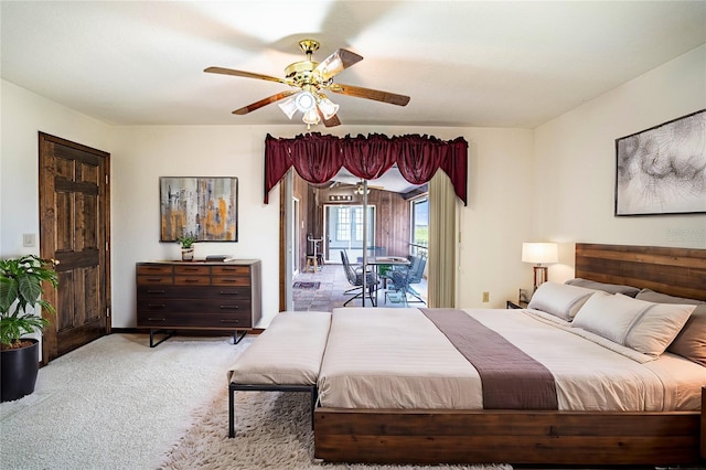 carpeted bedroom featuring access to outside and ceiling fan