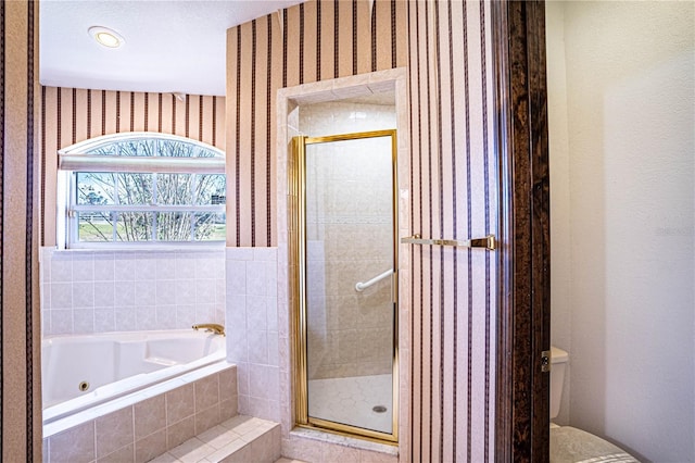 bathroom with plus walk in shower and toilet