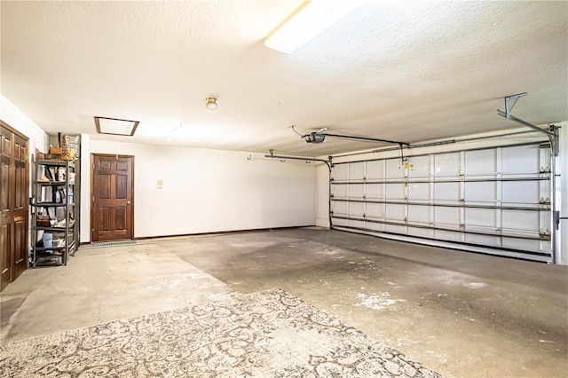 garage with a garage door opener and baseboard heating