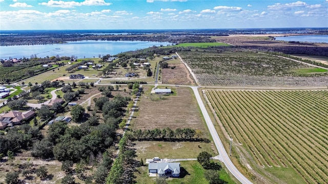 aerial view with a water view and a rural view