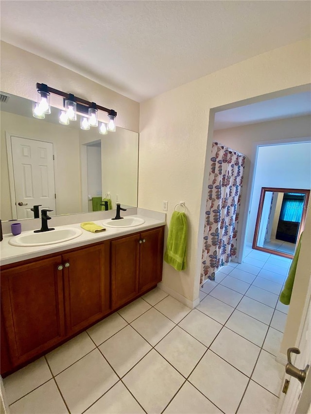 bathroom with vanity and tile patterned floors