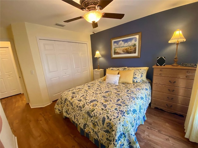 bedroom with ceiling fan, hardwood / wood-style floors, and a closet