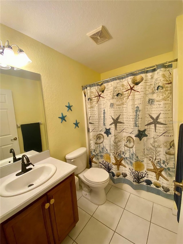 bathroom with tile patterned floors, toilet, a shower with curtain, a textured ceiling, and vanity