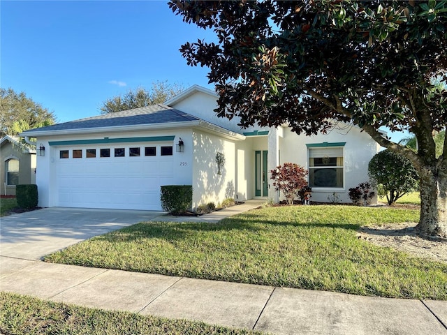 view of front of house with a garage and a front yard