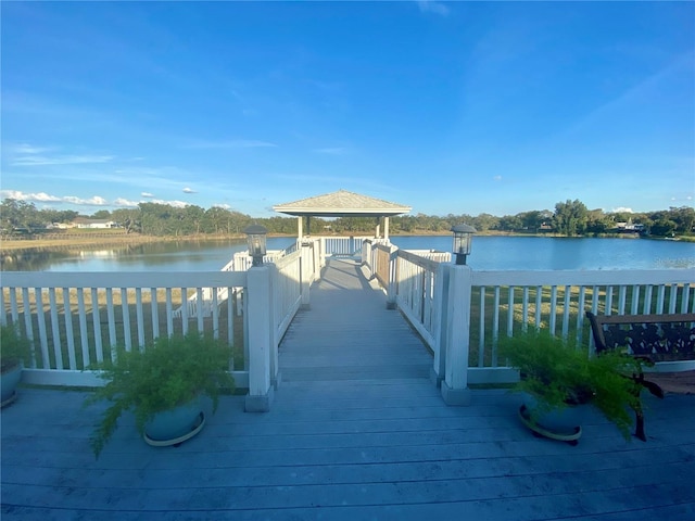 dock area featuring a gazebo and a water view