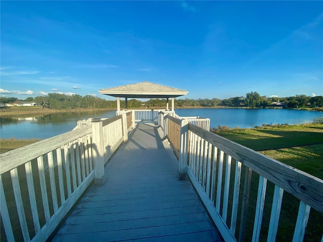 dock area with a gazebo and a water view