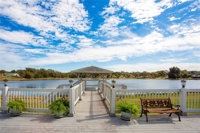 dock area with a gazebo and a water view