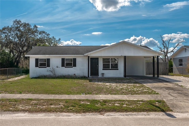 single story home with a carport and a front yard