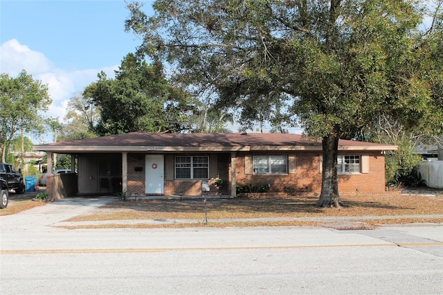 ranch-style home with a carport