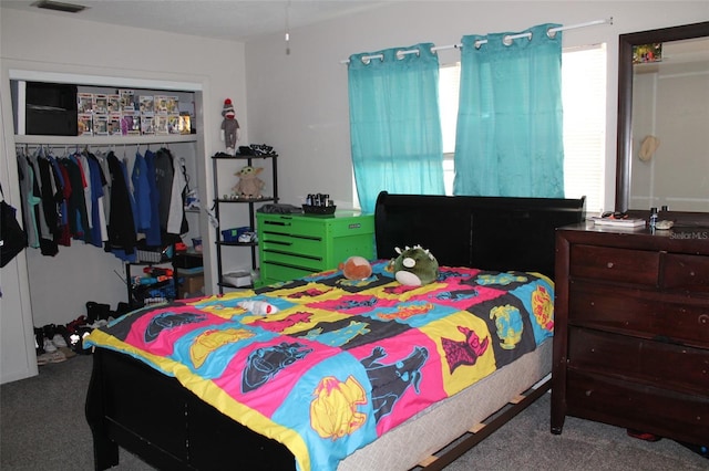 carpeted bedroom featuring a closet