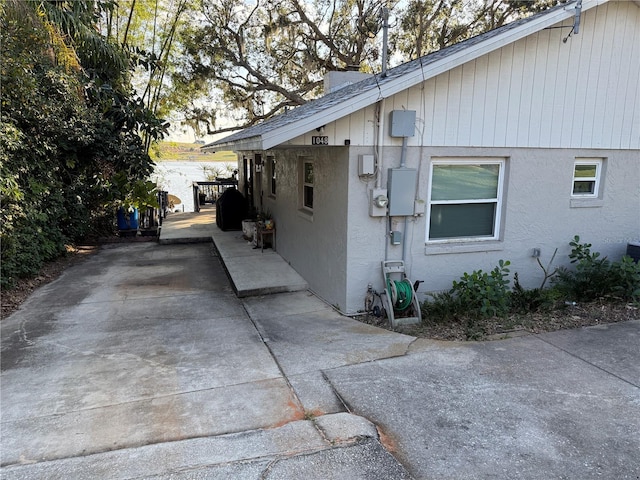 view of side of home featuring a patio