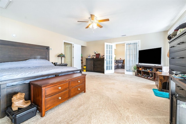 bedroom featuring light carpet, french doors, and ceiling fan