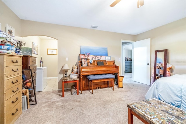 bedroom with light colored carpet and ceiling fan