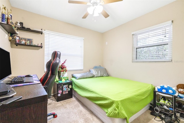 bedroom featuring ceiling fan and light colored carpet