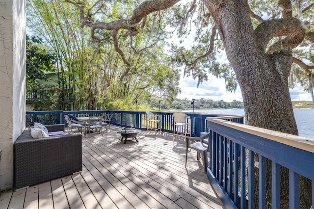 wooden deck with a water view