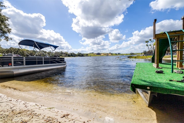 dock area featuring a playground and a water view