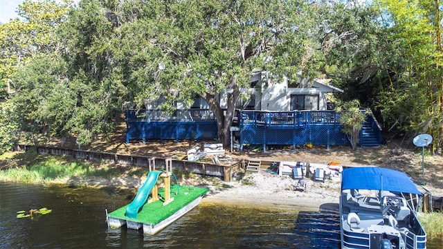 view of dock with a deck with water view