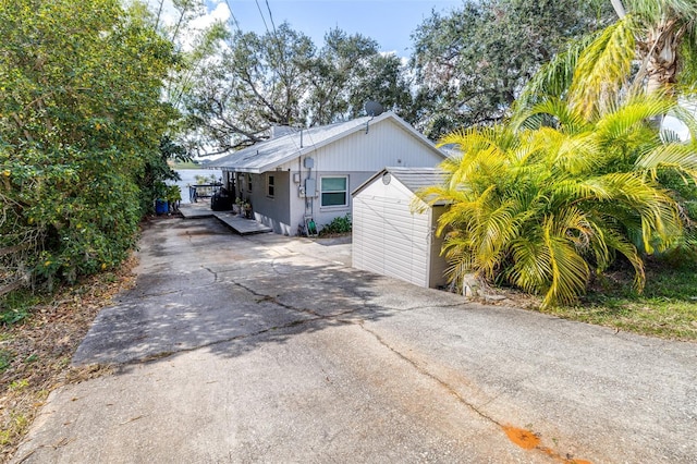 view of side of home with a carport