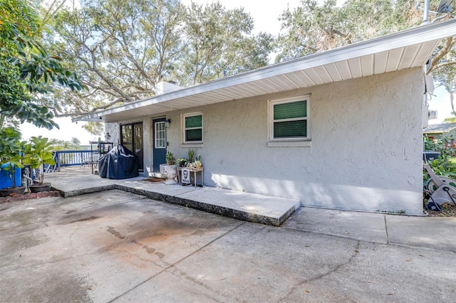 back of property featuring a patio area