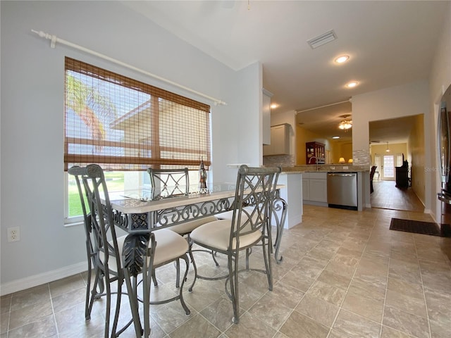 dining space with plenty of natural light, sink, and ceiling fan