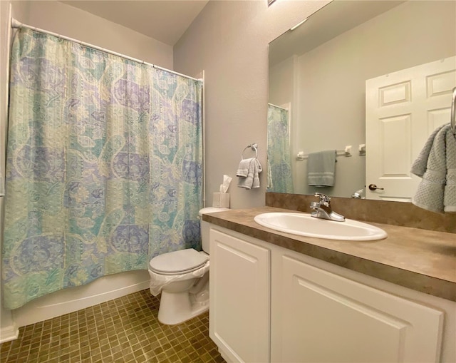 full bathroom featuring vanity, tile patterned floors, toilet, and shower / tub combo with curtain