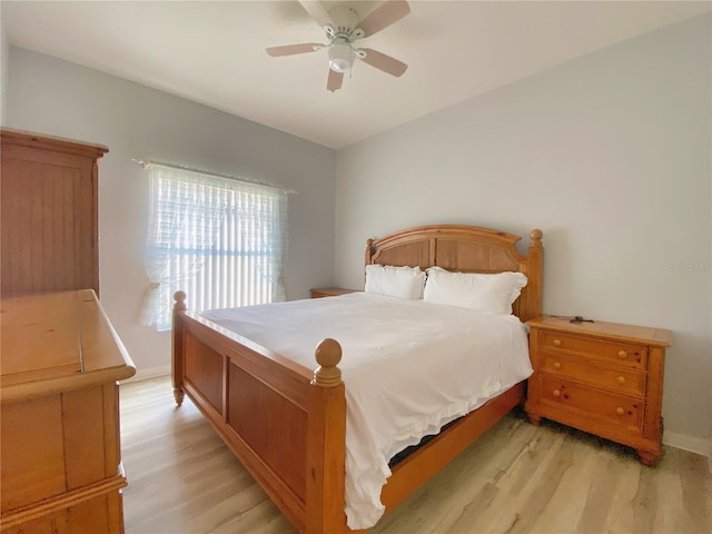 bedroom with ceiling fan and light hardwood / wood-style flooring