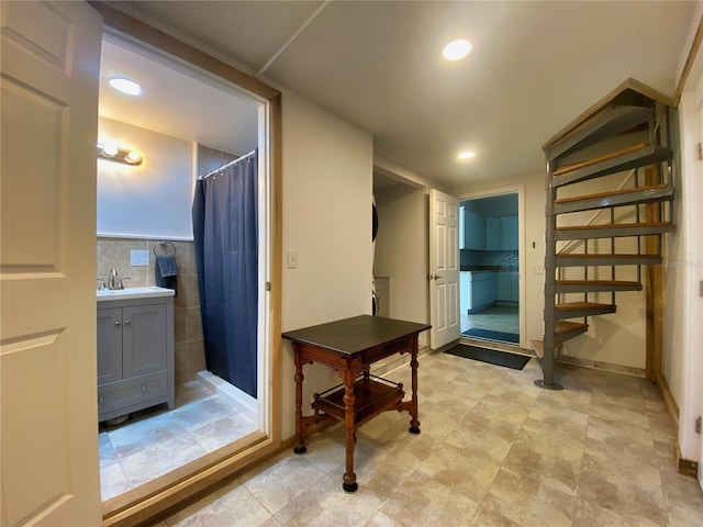 bathroom with vanity and curtained shower