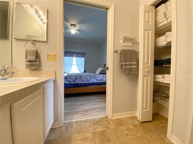 bathroom with vanity and ceiling fan