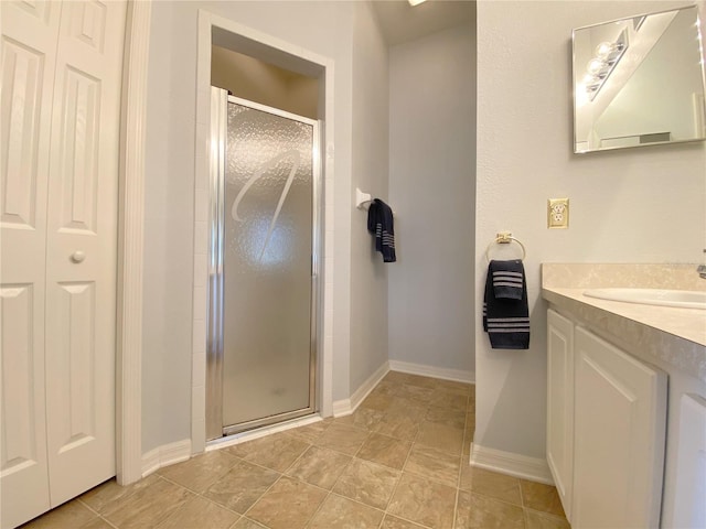 bathroom featuring vanity and an enclosed shower