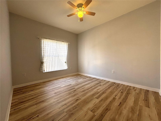 empty room with light hardwood / wood-style floors and ceiling fan