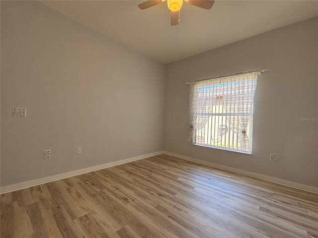 unfurnished room with ceiling fan and light wood-type flooring